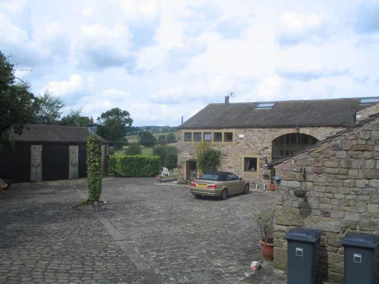 Conversion of detached garage to create two holiday cottages