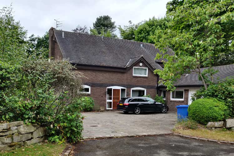 Conversion of existing house into three apartments, with substantial extensions in a Conservation Area