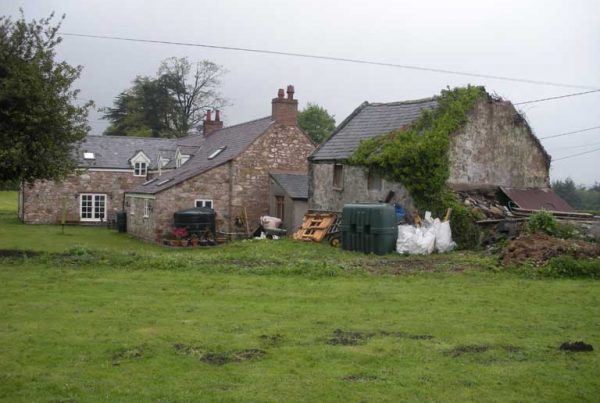 Erection of detached outbuilding in open countryside