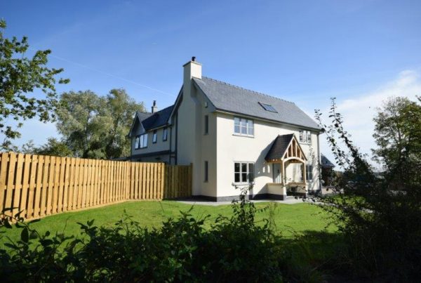Large two-storey replacement contemporary dwelling, following a substantial house extension to a 1. 5 story house, in open countryside contrary to local policy.